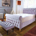 Signature deep buttoned chesterfield fabric bed in a modern UK bedroom