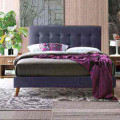 Time Living dark grey fabric bed frame tufted headboard in a modern bedroom with table and lamp